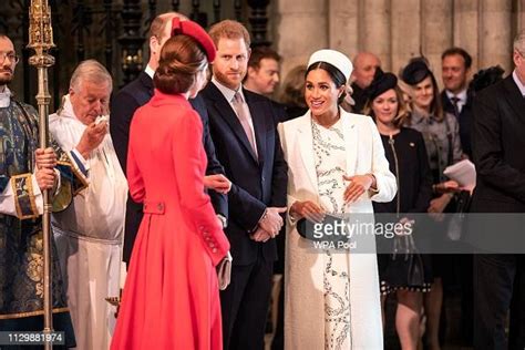 Catherine The Duchess Of Cambridge Talks With The Meghan Duchess Of