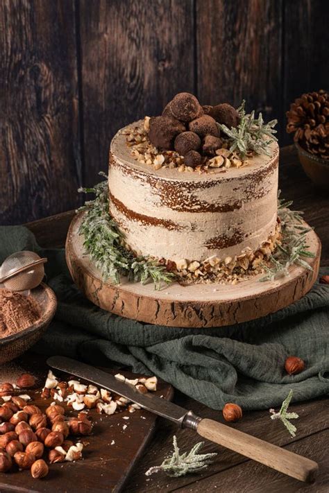 Delicious Naked Chocolate And Hazelnuts Cake On Table Rustic Wood