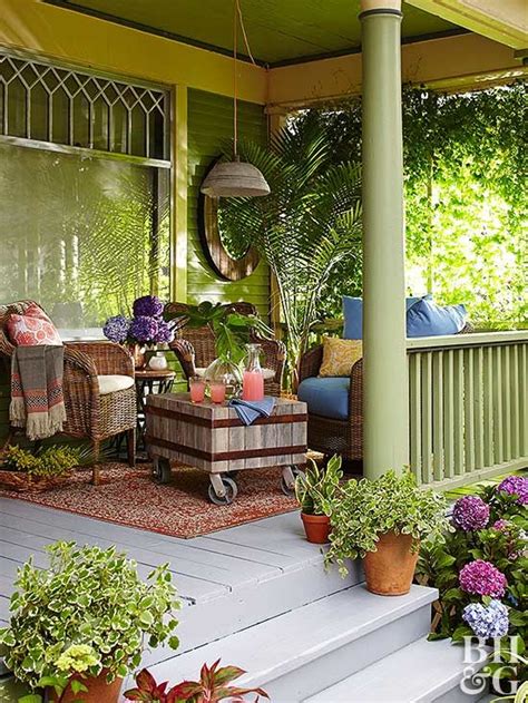 A Porch With Potted Plants On The Steps