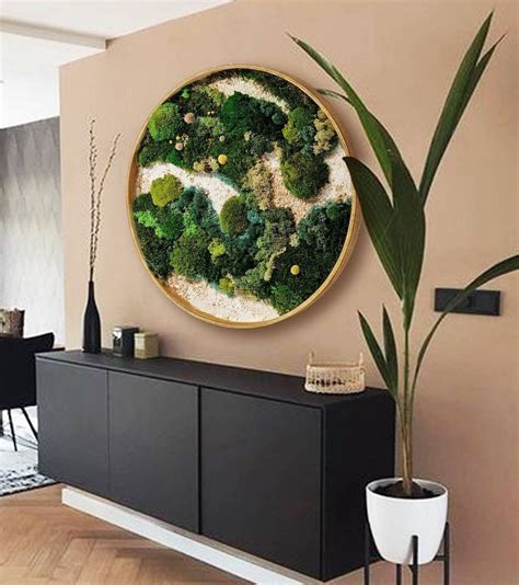 A Living Room With A Large Painting On The Wall And A Potted Plant Next