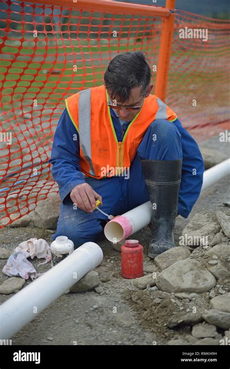 A Plumber Joins New Pipes For A Stormwater Drain Stock Photo Alamy