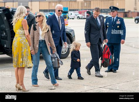 US President Joe Biden walks with his grandson Beau Biden Jr.(2-R), son ...