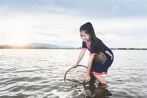 Beautiful Asian Girls Fishing In The Lake With Fish Trap Life Style Of