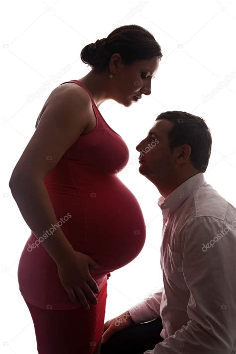 Silhouette Beautiful Pregnant Woman With Big Belly And Her Husband