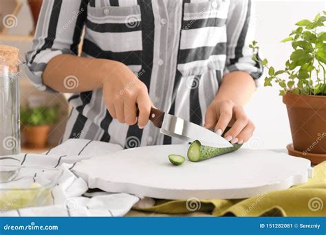 Woman Cutting Fresh Cucumber On Wooden Board Stock Image Image Of