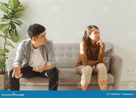 Upset Couple At Home Handsome Man And Beautiful Young Woman Are Having