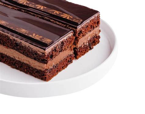 Premium Photo Two Sliced Chocolate Cake On A White Plate