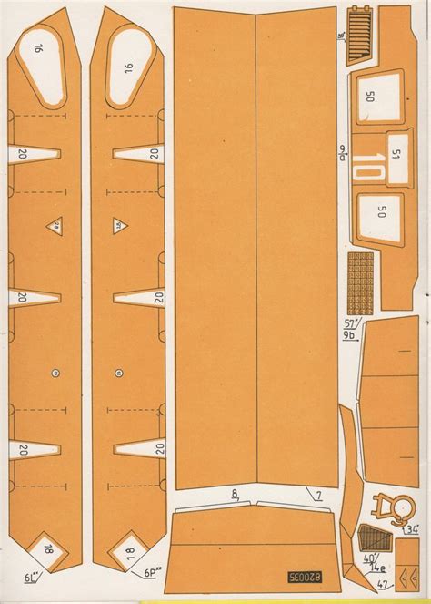 An Orange Paper Cut Out With Measurements