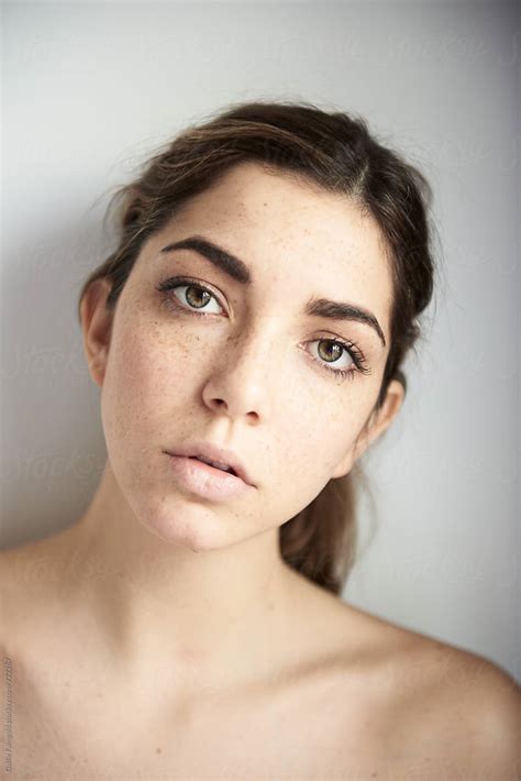 Calm Brunette Looking At Camera By Stocksy Contributor Guille Faingold Stocksy