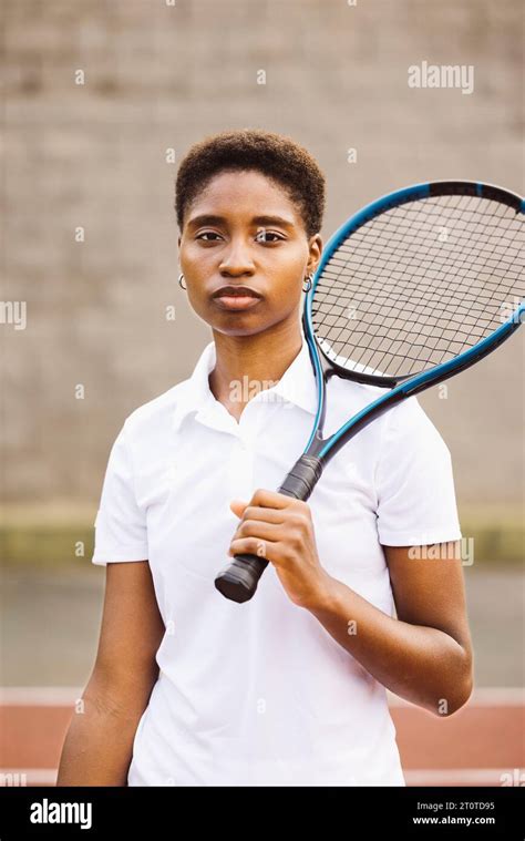 Portrait Of A Young Beautiful Women With Tennis Clothes And Racket In A