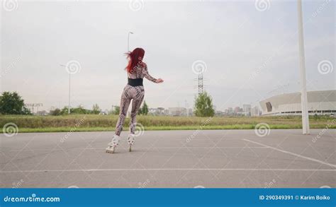 Slim Woman In Sports Overalls Rollerblading Beautiful Happy Girl