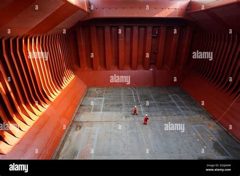 Crew Preparing Cargo Hold Before Loading Cement Applying Hold Block