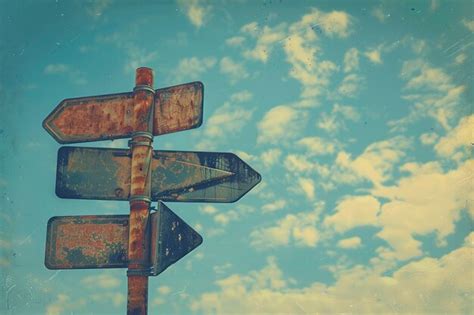 Premium Photo Blank Directional Road Signs Against Blue Sky Background