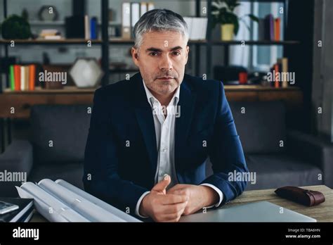 Mature Architect Working With Drawings In Office Stock Photo Alamy
