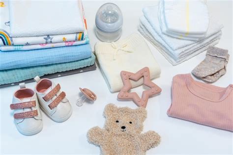 Premium Photo Baby Clothes And Accessories On A Light Background