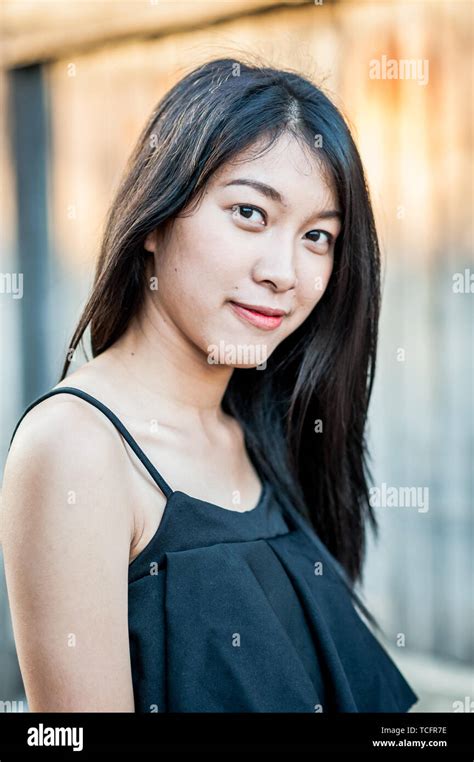 A Beautiful Thai Girl Poses At The Famous Tourist Landmark Pae Gate