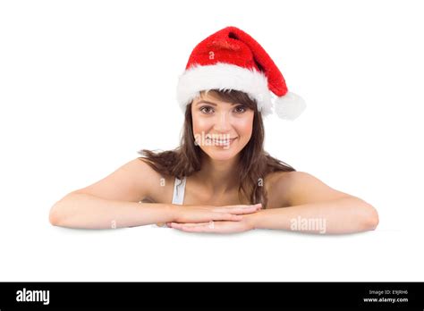 Festive Brunette Leaning On Large Poster Stock Photo Alamy