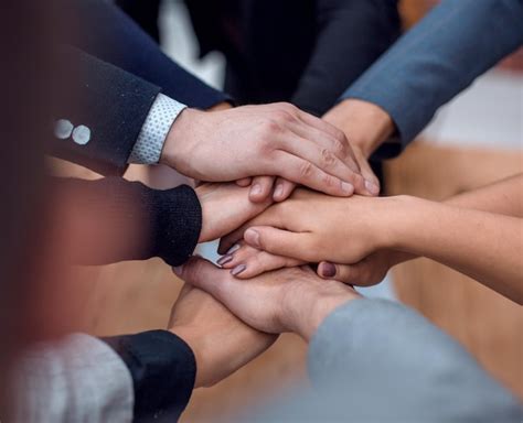 Close Up Business Team Putting Their Hands Together Stock Image