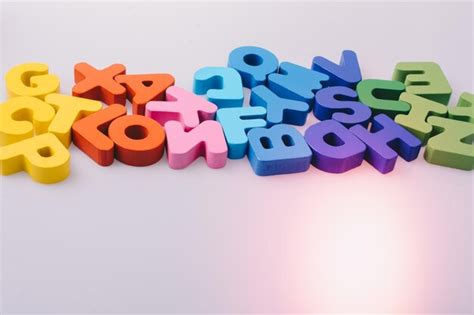 Premium Photo | Colorful alphabet letter blocks scattered randomly on white background