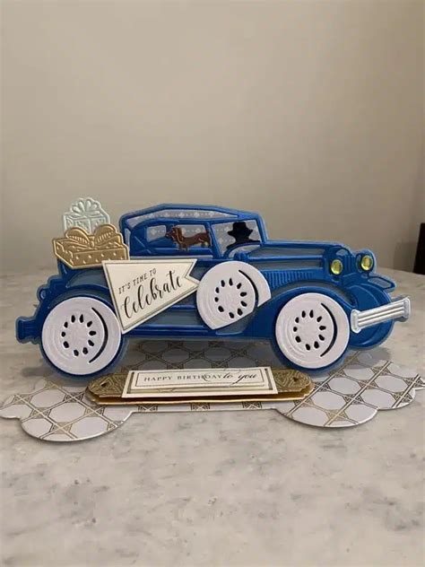 Anna Griffin Cards A Blue And White Toy Car Sitting On Top Of A Marble