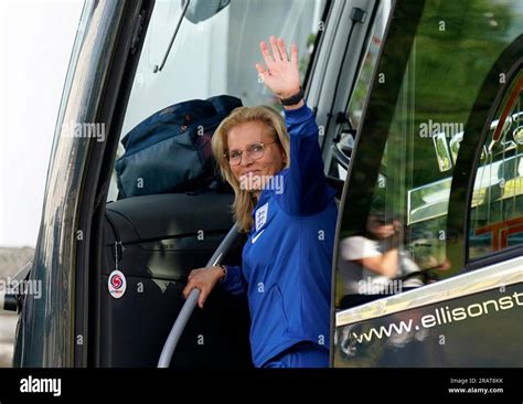 England manager Sarina Wiegman waves as the England team depart from ...