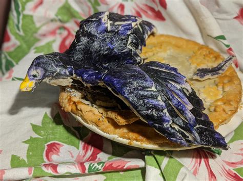 Black bird escaping pie! It's a mixed berry pie. The Raven is made from