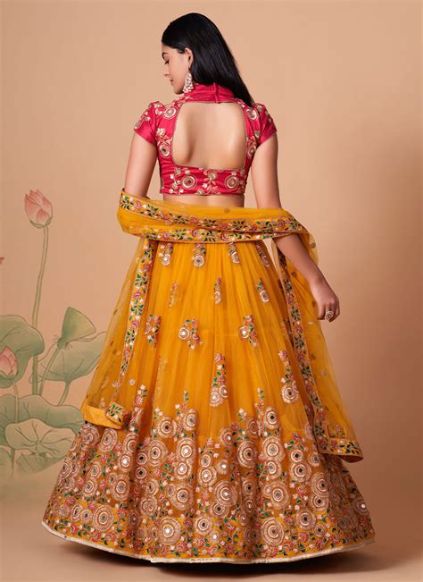 Mystic Net Embroidered Mustard Lehenga Choli