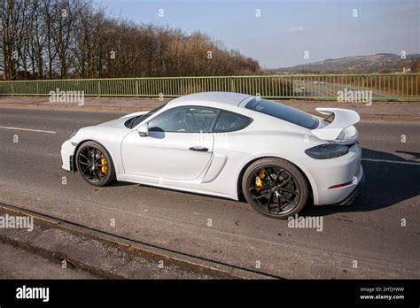 Porsche Cayman GT4 White Car with movable spoiler Stock Photo - Alamy