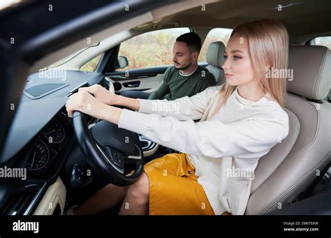 Happy Man And Woman Traveling In Car Young Couple Sitting On Front