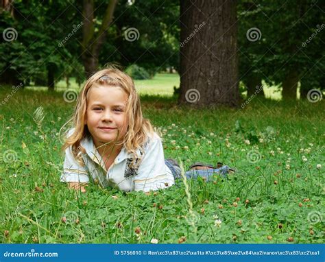 Child Lying In Grass Stock Photo Image Of Smiling Park 5756010