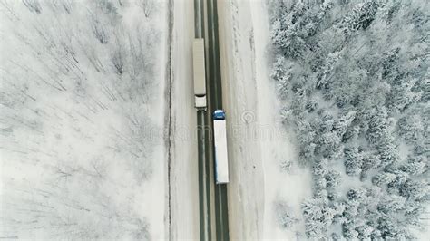 Aerial View Of A B Freight Truck Driving Down A Highway Running Along A