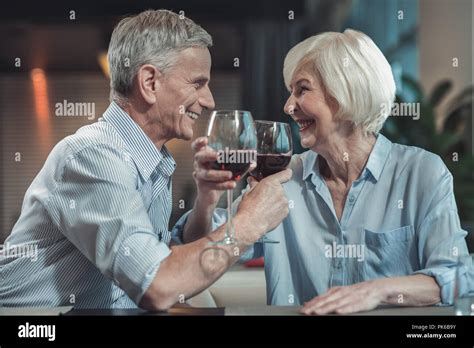 Cheerful Mature Man Drinking Wine In Cafe Stock Photo Alamy