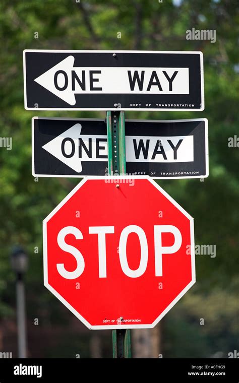 STOP SIGN WITH ONE WAY SIGNS Stock Photo - Alamy