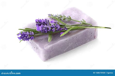 Homemade Lavender Soap Bar With Lavender Flowers Atop Isolated On White