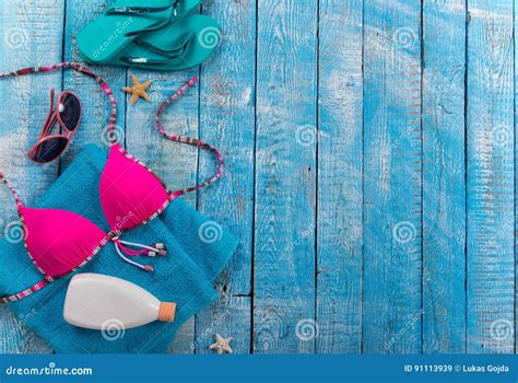 Beauty Bikini And Accessories On Rustic Wooden Table Stock Image