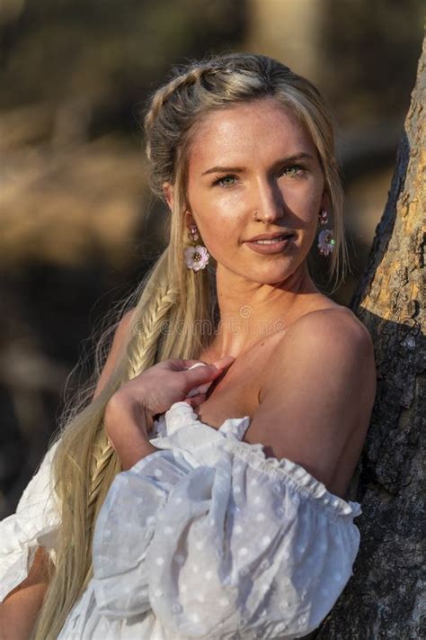 A Lovely Blonde Model Enjoys An Spring Day Outdoors Stock Photo Image