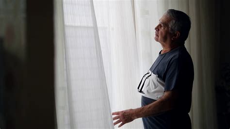 Older Man Standing Window Observing Outside Stock Footage Sbv 348713180 Storyblocks