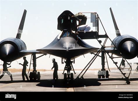 Aircraft Maintainers Assist An Sr 71 Blackbird Pilot Debarking The