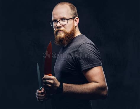 Portrait Of A Redhead Bearded Male Wearing Glasses Dressed In A Gray T