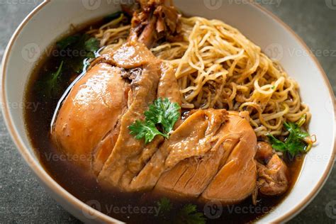 Noodles With Braised Chicken In Brown Soup Stock Photo At Vecteezy