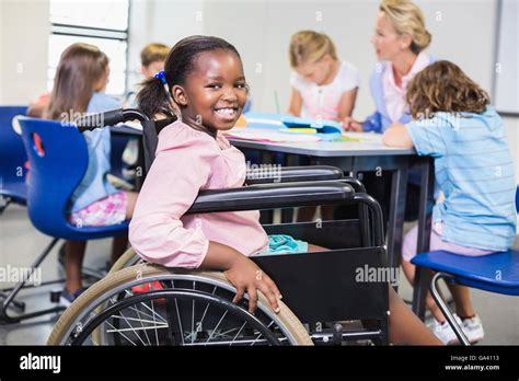 Disabled Child In Wheelchair Stock Photos And Disabled Child In