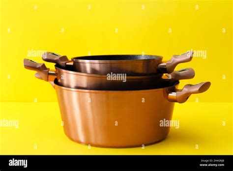 Metal Cooking Pots On Color Background Stock Photo Alamy