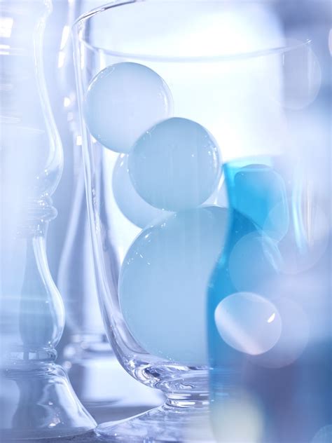 Blue Glass Orbs Filling A Glass © Laurie Frankel Photography Still Life Commercial