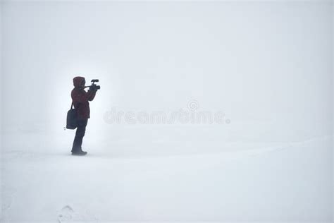 Lonely Photographer with Photocamera Shooting in Winter Field Stock ...