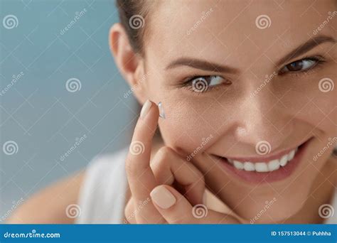 Eye Care Smiling Woman With Contact Eye Lens On Finger Closeup Stock