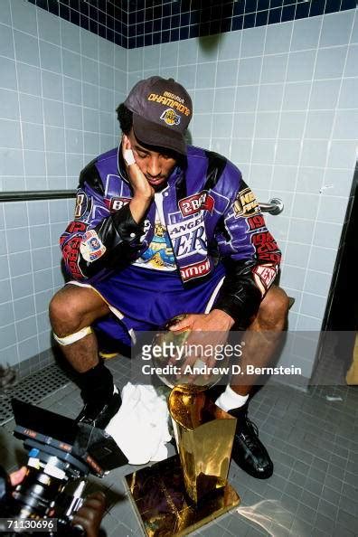 Kobe Bryant Of The Los Angeles Lakers Displaying The Nba Championship