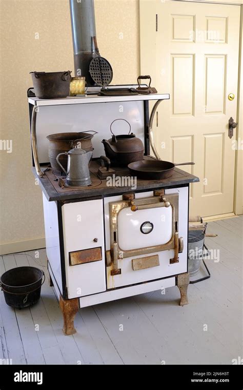 Old Fashioned Vintage Stove And Oven With Pots And Kettles Stock Photo