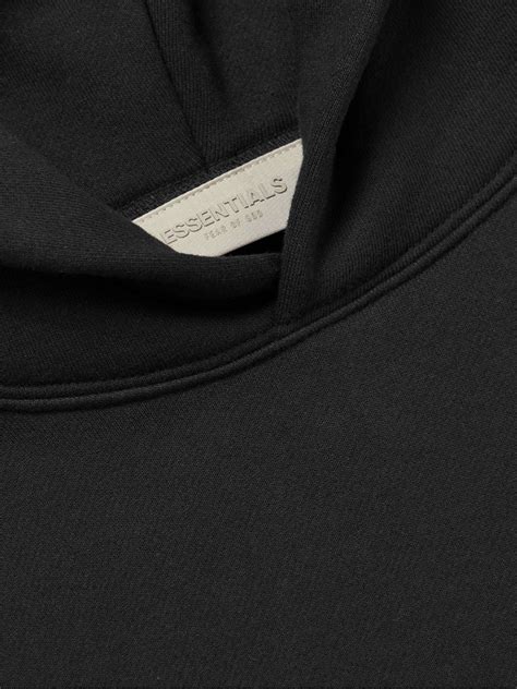 Black Logo Flocked Cotton Blend Jersey Hoodie Fear Of God Essentials Mr Porter