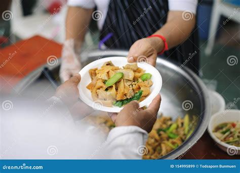 Charity Food Is Free For People In Slums Hands Of Volunteers Serves