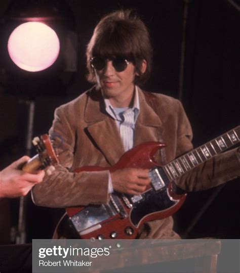 The Beatles 196604 George Harrison Playing His Guitar During The